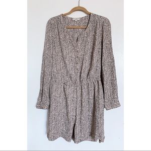 Tan jumper with black pattern.